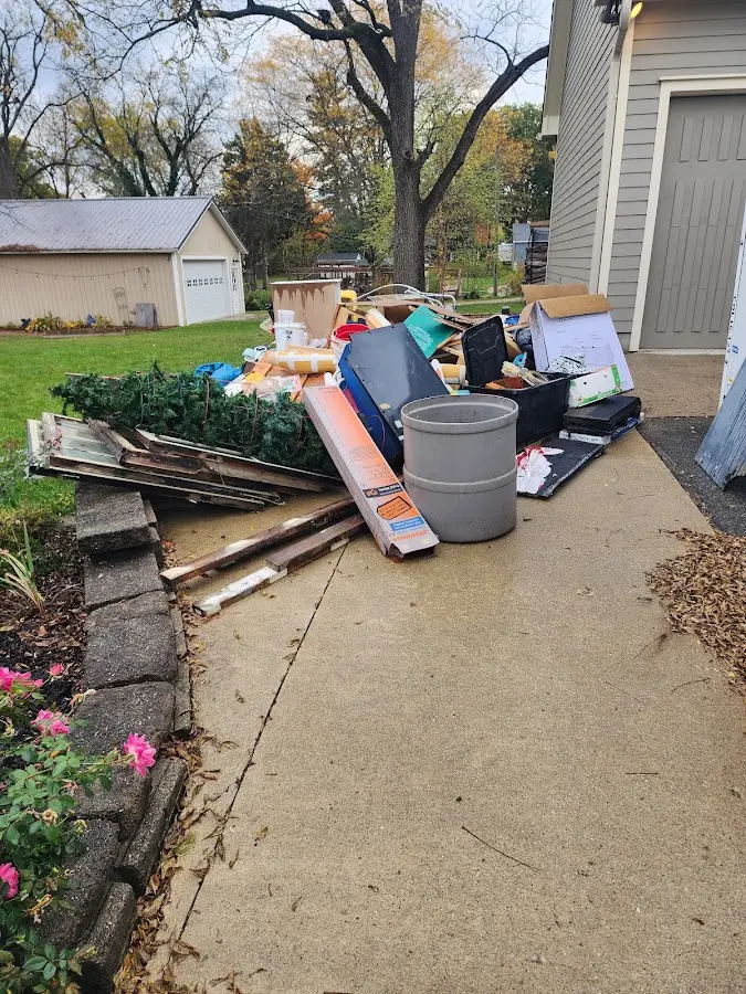 Dumpster being loaded with debris for 3 Yard Dumpster Rental in Thornbury